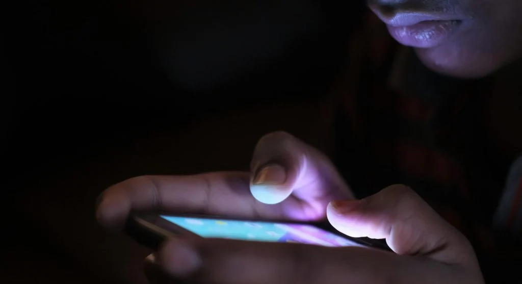 person limiting smartphone usage