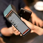 Smartphone making a contactless payment using NFC
