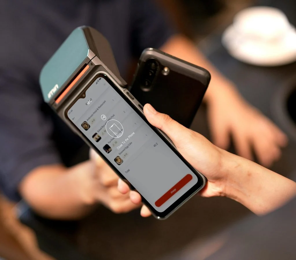 Smartphone making a contactless payment using NFC