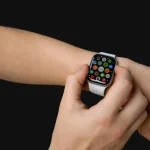 A person wearing a smartwatch on their wrist, demonstrating its functionality