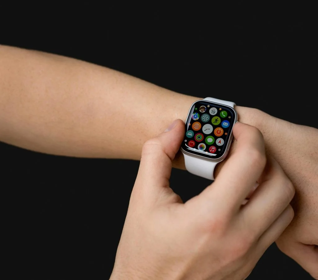 A person wearing a smartwatch on their wrist, demonstrating its functionality