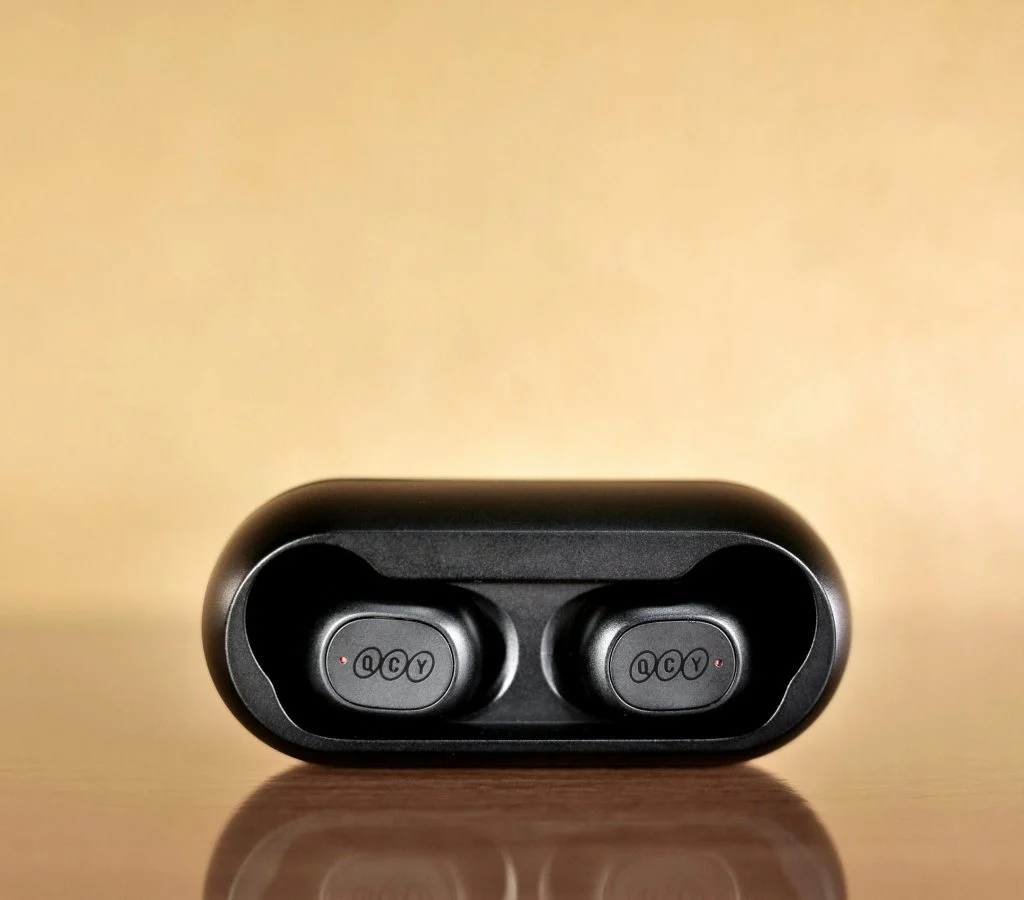 Person checking sound quality of wireless earbuds