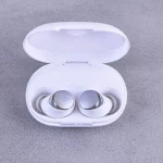 Person holding different wireless earbud models