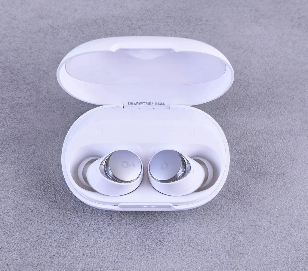 Person holding different wireless earbud models