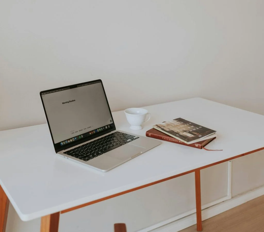 Laptop on a clean and organized desk with a workspace setup for better productivity