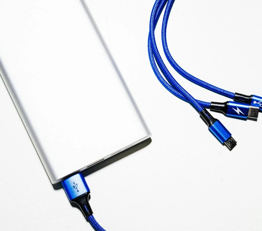 Illustration of a smartphone plugged into a charger at night