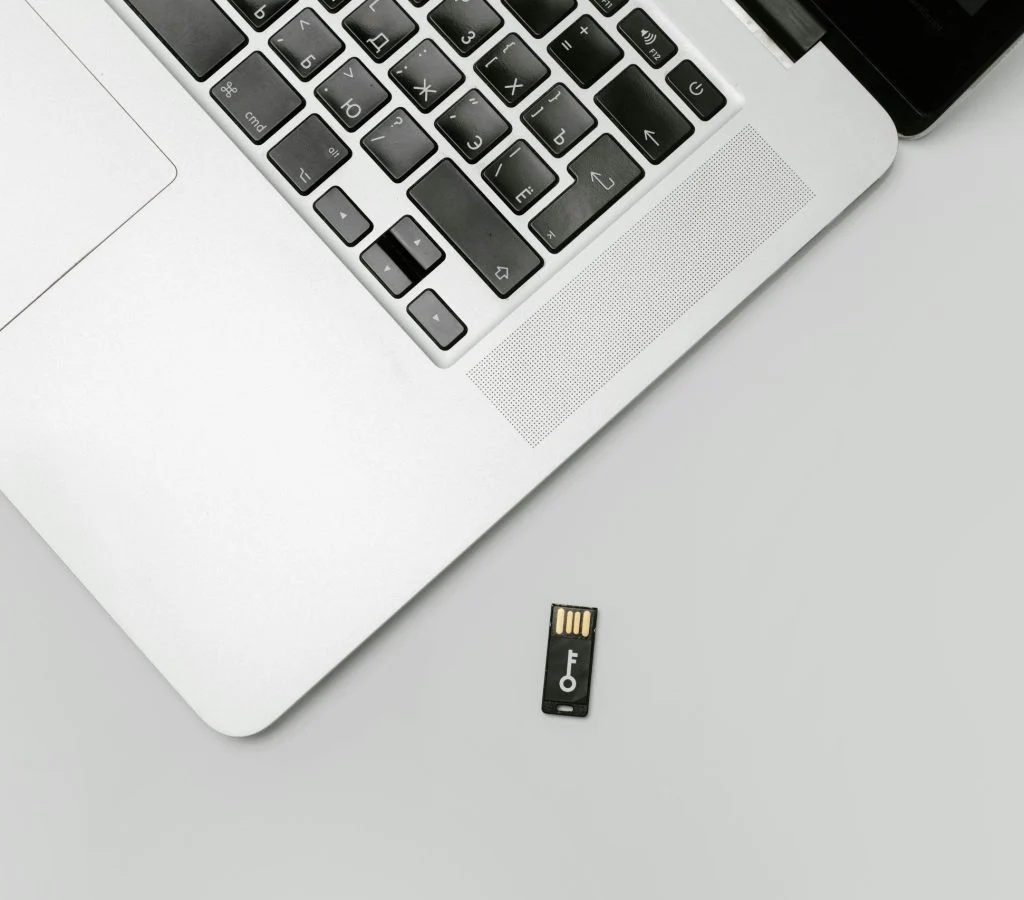 A person organizing their computer files to free up storage space